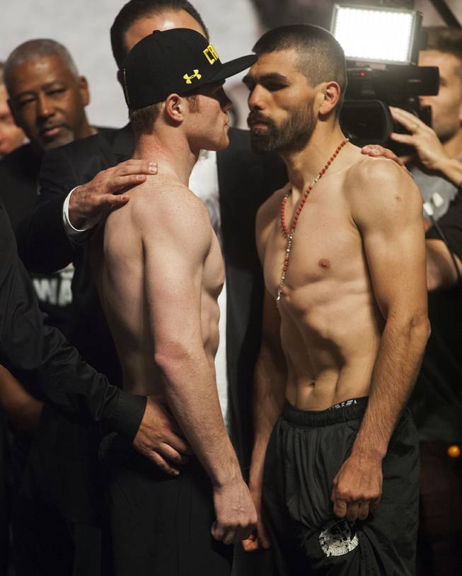 Super welterweights Canelo Alvarez and opponent Alfredo "El Perro" Angulo, both of Mexico, face off following their weigh-ins at the MGM Grand Arena on Friday, March 07, 2014.